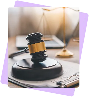 A judge's gavel rests on its sound block, symbolising legal authority.