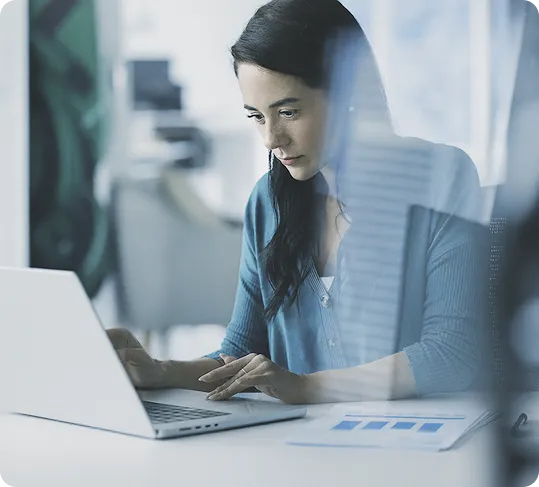 An entrepreneur focuses intently on her OrderEazi dashboard, analysing business metrics.