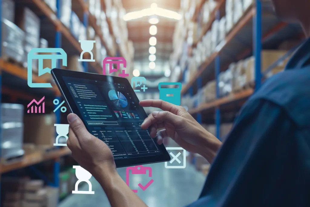 Warehouse worker using a tablet with analytics dashboard, surrounded by digital icons representing inventory tasks, demonstrating OrderEazi's user-friendly approach to real-time stock management.