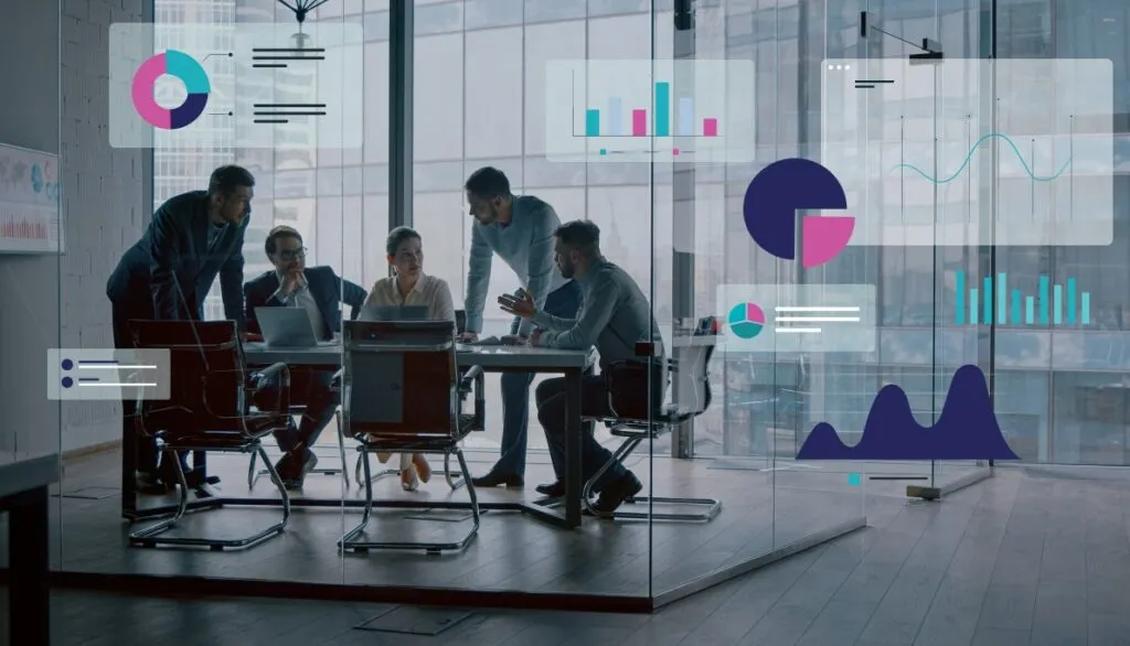 Business team in a glass-walled meeting room, surrounded by floating digital charts and graphs, illustrating data-driven collaboration and analysis in a modern office setting.